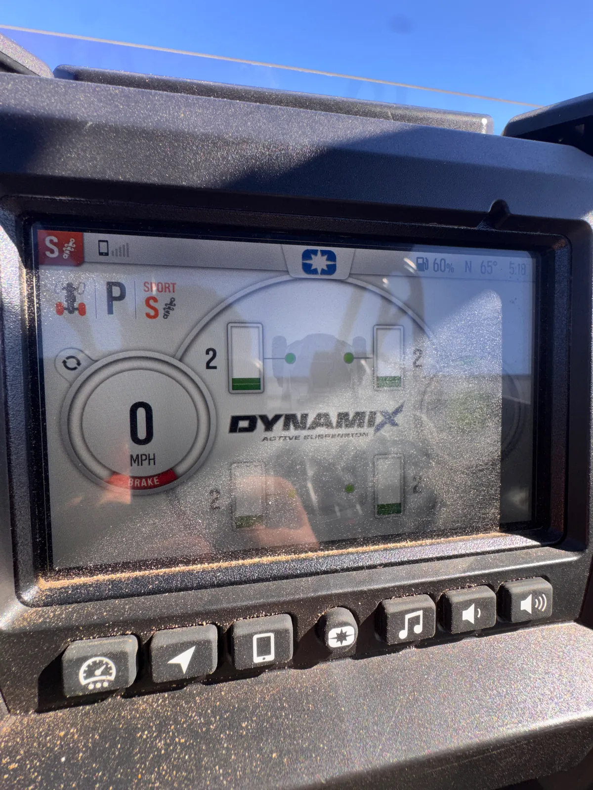 RZR Pro S Ultimate "Ninja" dash screen showing the DYNAMIX Active Suspension settings for each wheel in Sport mode, with music and volume buttons below